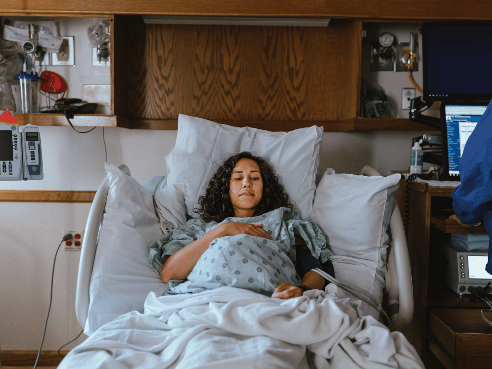 woman in labor in hospital bed
