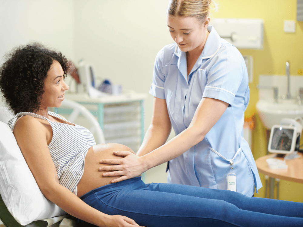 woman in labor in hospital being examined
