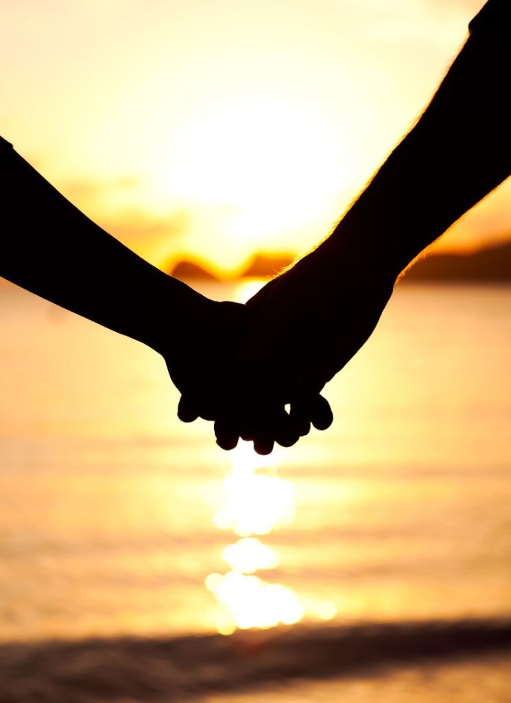 hands holding outside